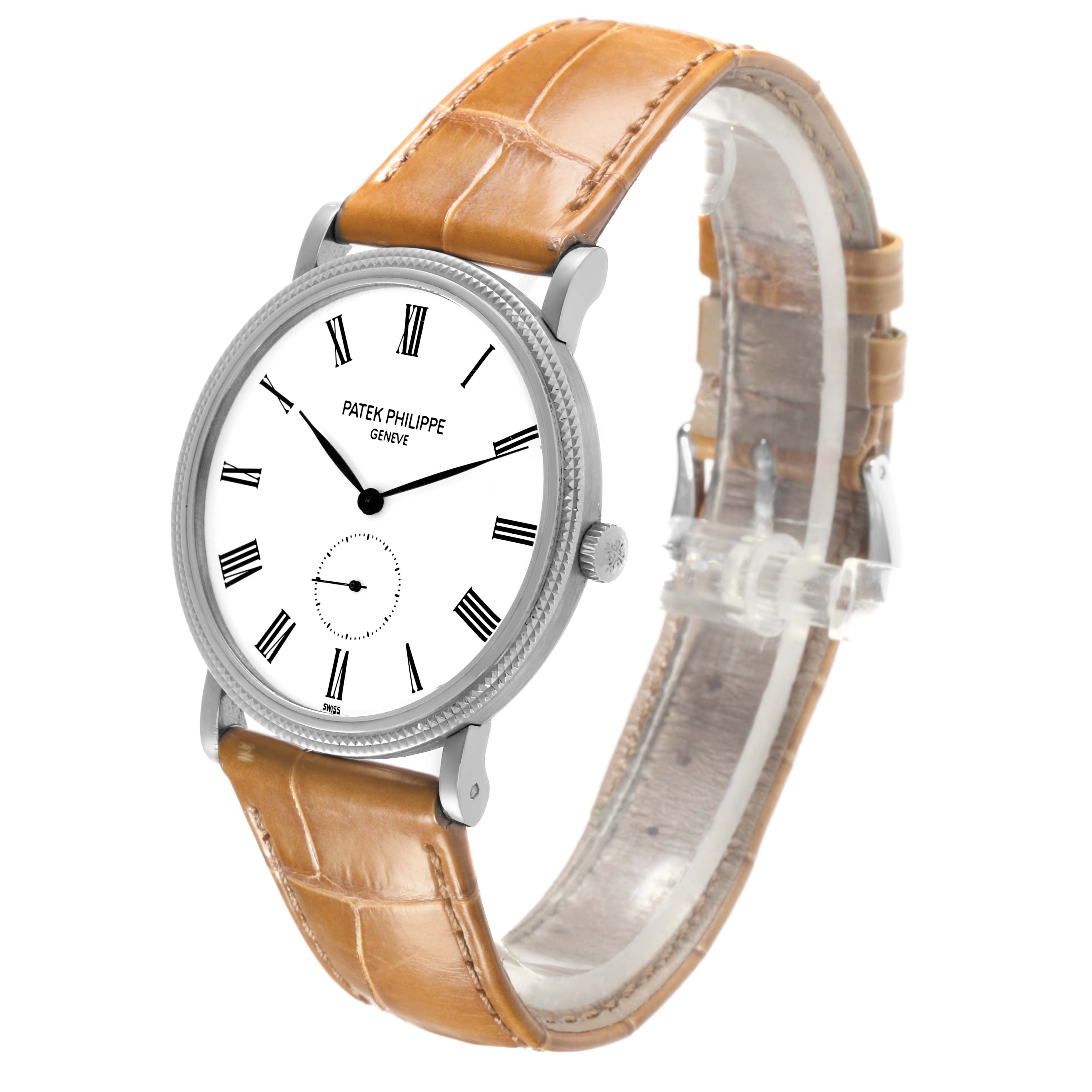 The Patek Philippe Calatrava 5119G-001 Men
s White Gold White Dial 5119G-001 Men
s White Gold White Dial watch is shown at a slight angle, highlighting the face, bezel, crown, and leather strap.