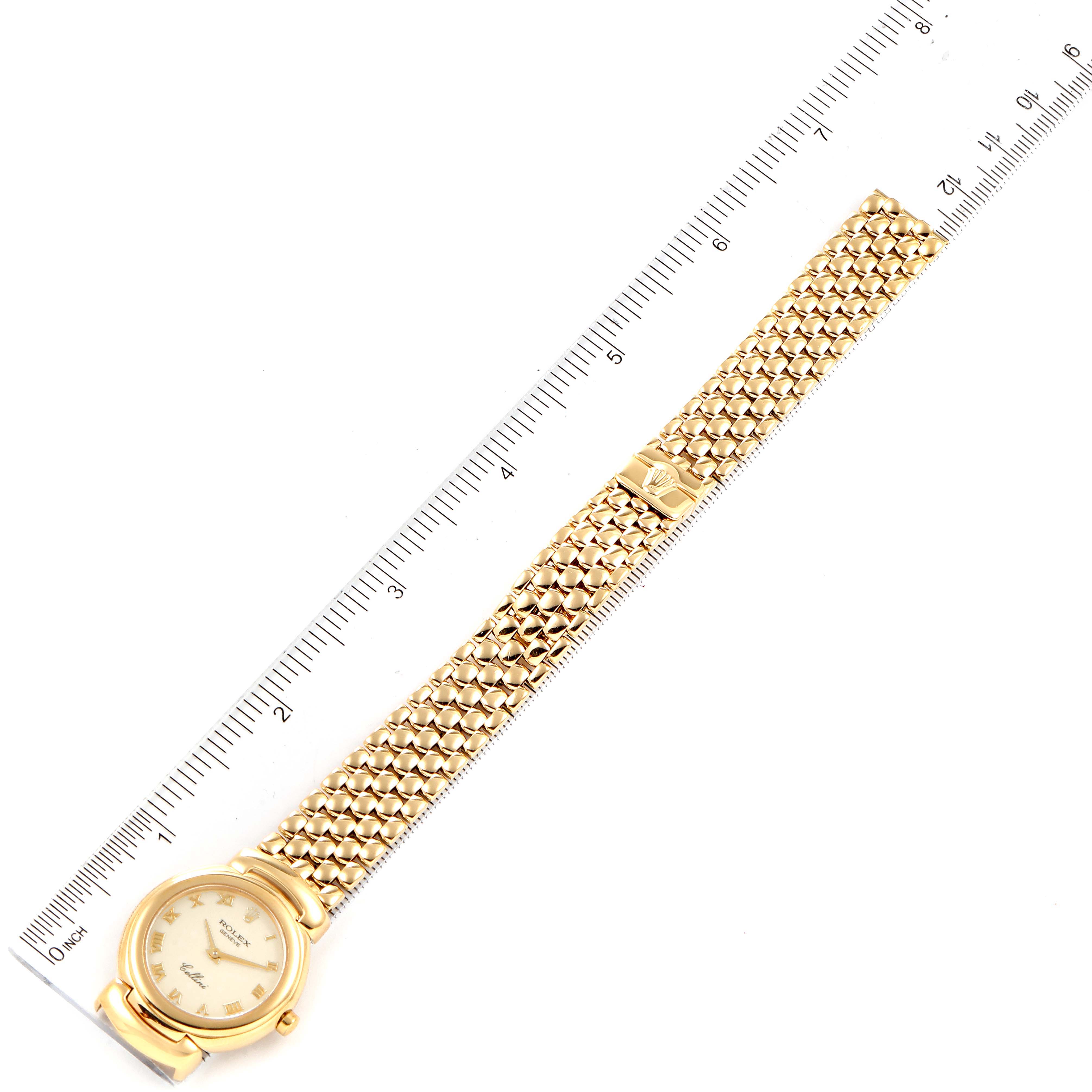 The Rolex Cellini 6621 Women's Yellow Gold Beige Dial 6621 Women's Yellow Gold Beige Dial watch is shown flat in a full view, displaying the dial, case, and entire bracelet against a measuring ruler.