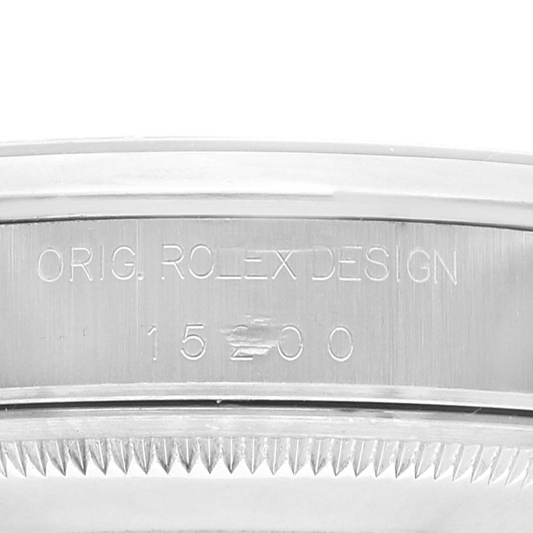 This close-up shows the engraved serial and model information on the side of a Rolex Date 15200 Men
s Stainless Steel Blue Dial 15200 Men
s Stainless Steel Blue Dial watch.