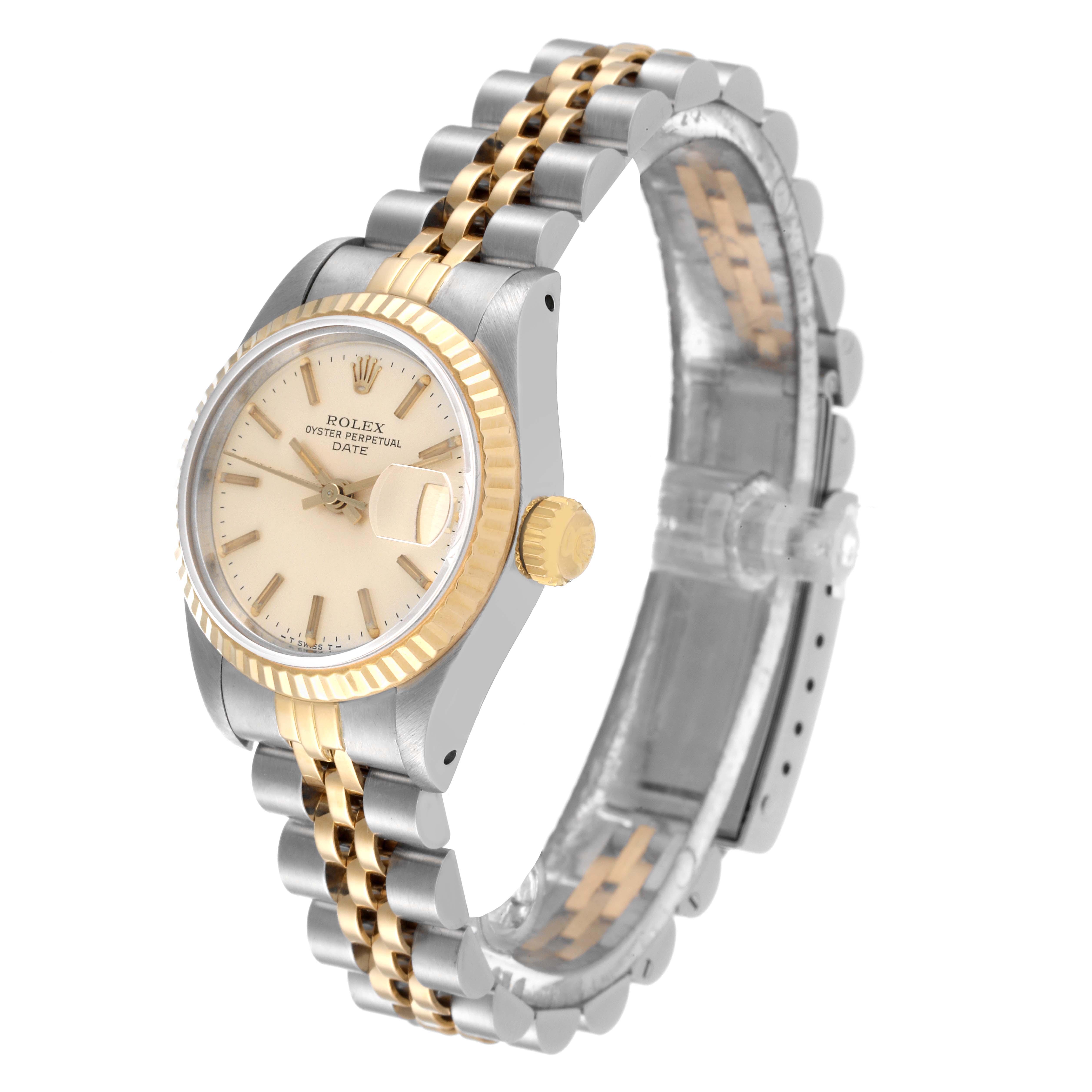 This is a Rolex Date 69173 Women's Steel and Gold (two tone) Silver Dial 69173 Women's Steel and Gold (two tone) Silver Dial model shown from a left-side angle emphasizing the case, dial, bezel, and part of the bracelet.