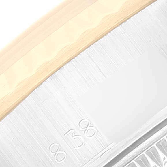 The image shows a close-up of the side profile of a Rolex Date 69173 Women's Steel and Gold (two tone) Silver Dial 69173 Women's Steel and Gold (two tone) Silver Dial watch, highlighting part of the case and bezel.