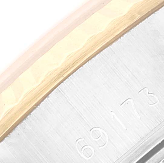 This close-up image shows part of the side casing with model number of a Rolex Date 69173 Women's Steel and Gold (two tone) Silver Dial 69173 Women's Steel and Gold (two tone) Silver Dial watch.