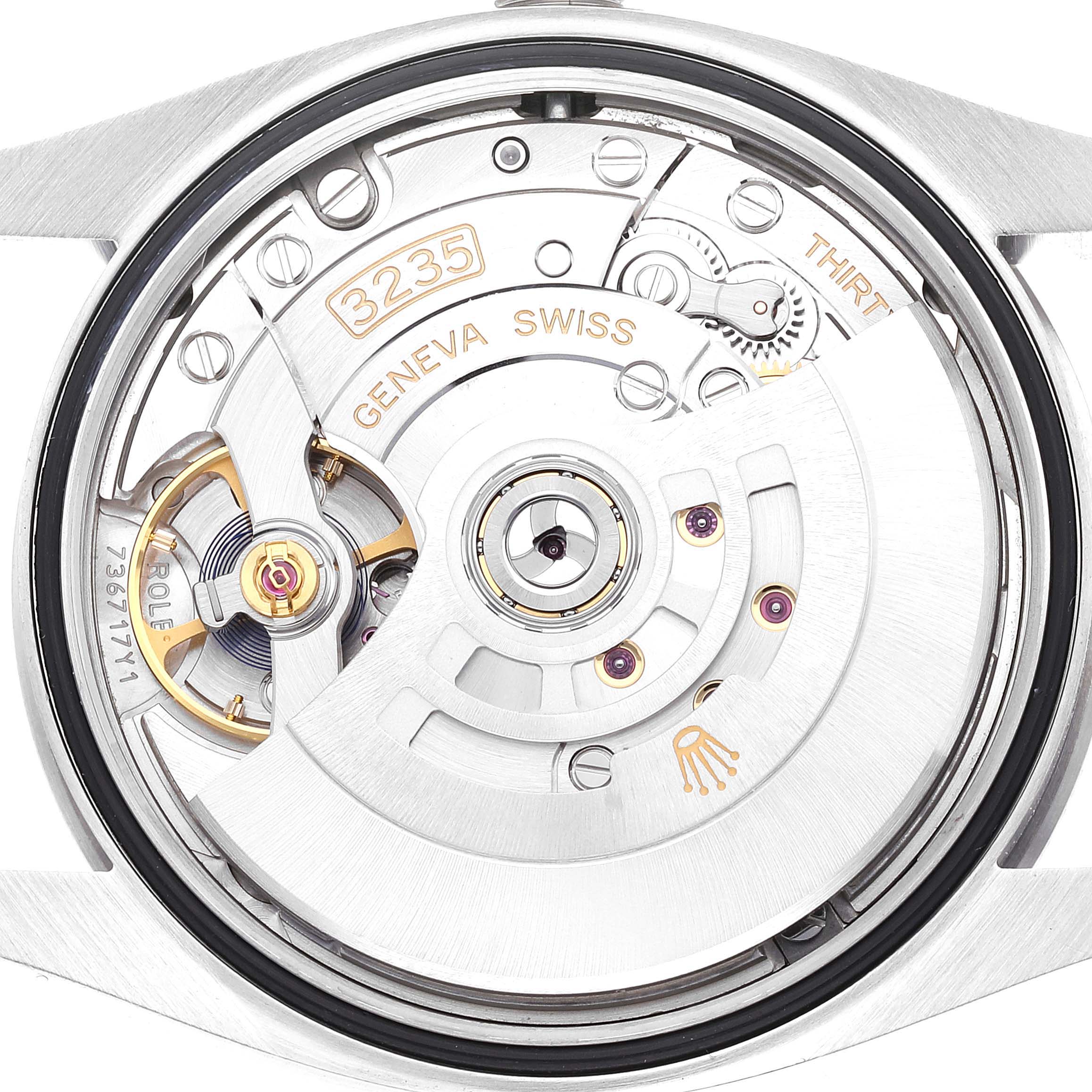 This image shows the movement mechanism of a Rolex Datejust 126200 Men's Stainless Steel Blue Dial 126200 Men's Stainless Steel Blue Dial watch from a close-up, backside view.