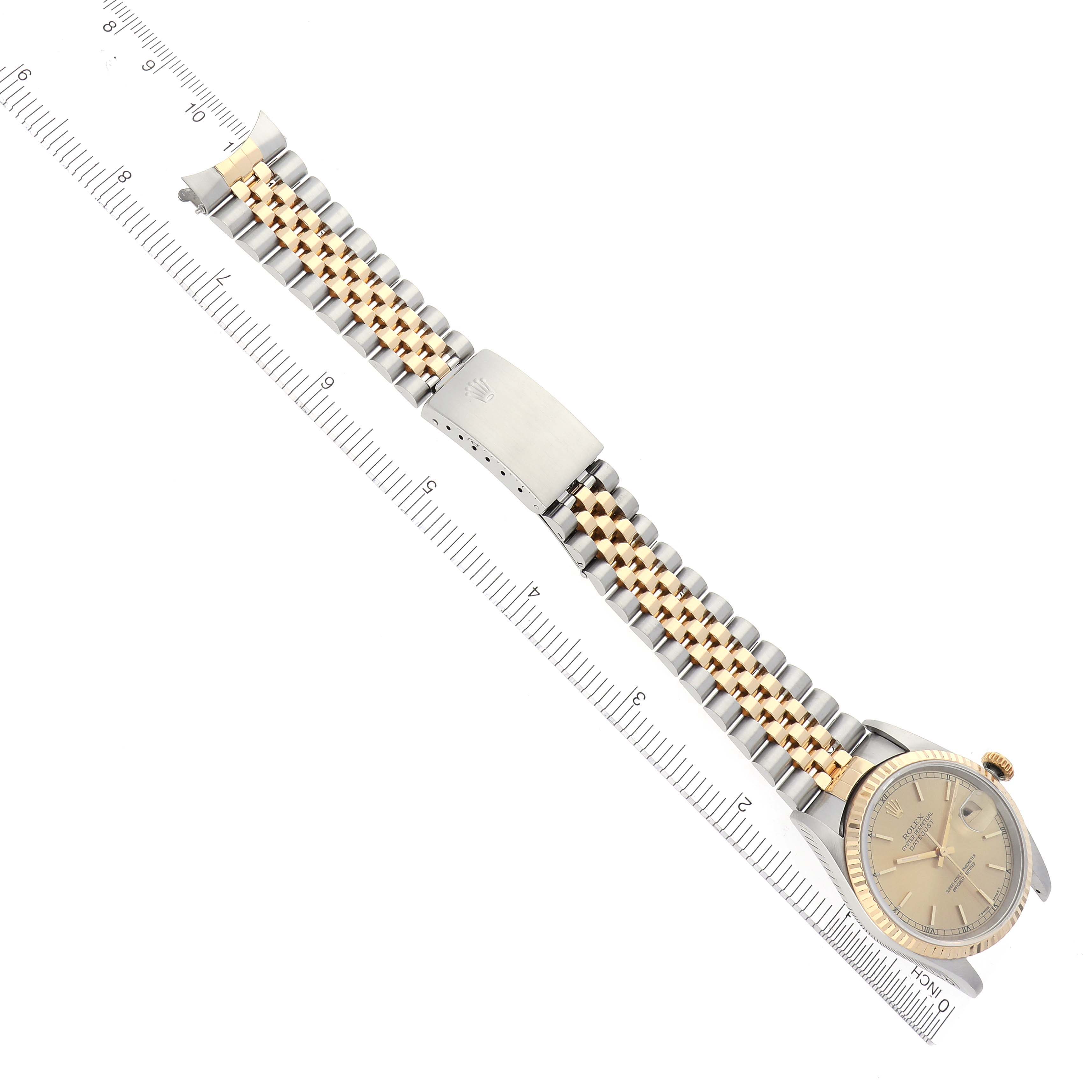 The Rolex Datejust 16233 Men
s Steel and Gold (two tone) Champagne Dial 16233 Men
s Steel and Gold (two tone) Champagne Dial watch is shown from a top-down angle, displaying the face, bracelet, and clasp.