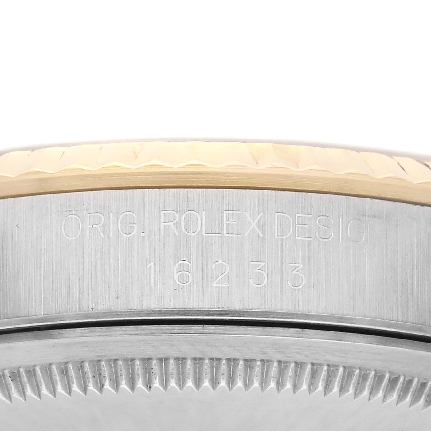 The image shows the side view of a Rolex Datejust 16233 Men
s Steel and Gold (two tone) Champagne Dial 16233 Men
s Steel and Gold (two tone) Champagne Dial watch case with the engraved model number 16233.