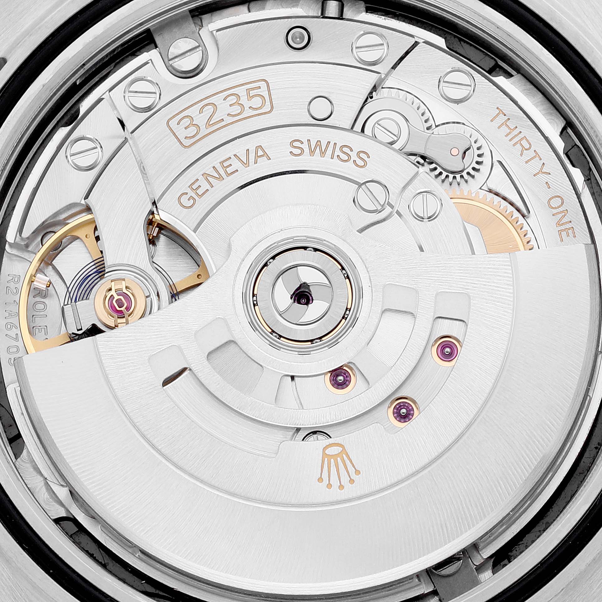 This image shows a close-up view of the mechanical movement of the Rolex Datejust 41 126334 Men
s Stainless Steel Black Dial 126334 Men
s Stainless Steel Black Dial model, highlighting the intricate parts and engravings.