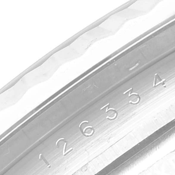 This image shows a close-up view of the engraved serial number on the inner bezel of a Rolex Datejust 41 126334 Men's Stainless Steel White Dial 126334 Men's Stainless Steel White Dial model.