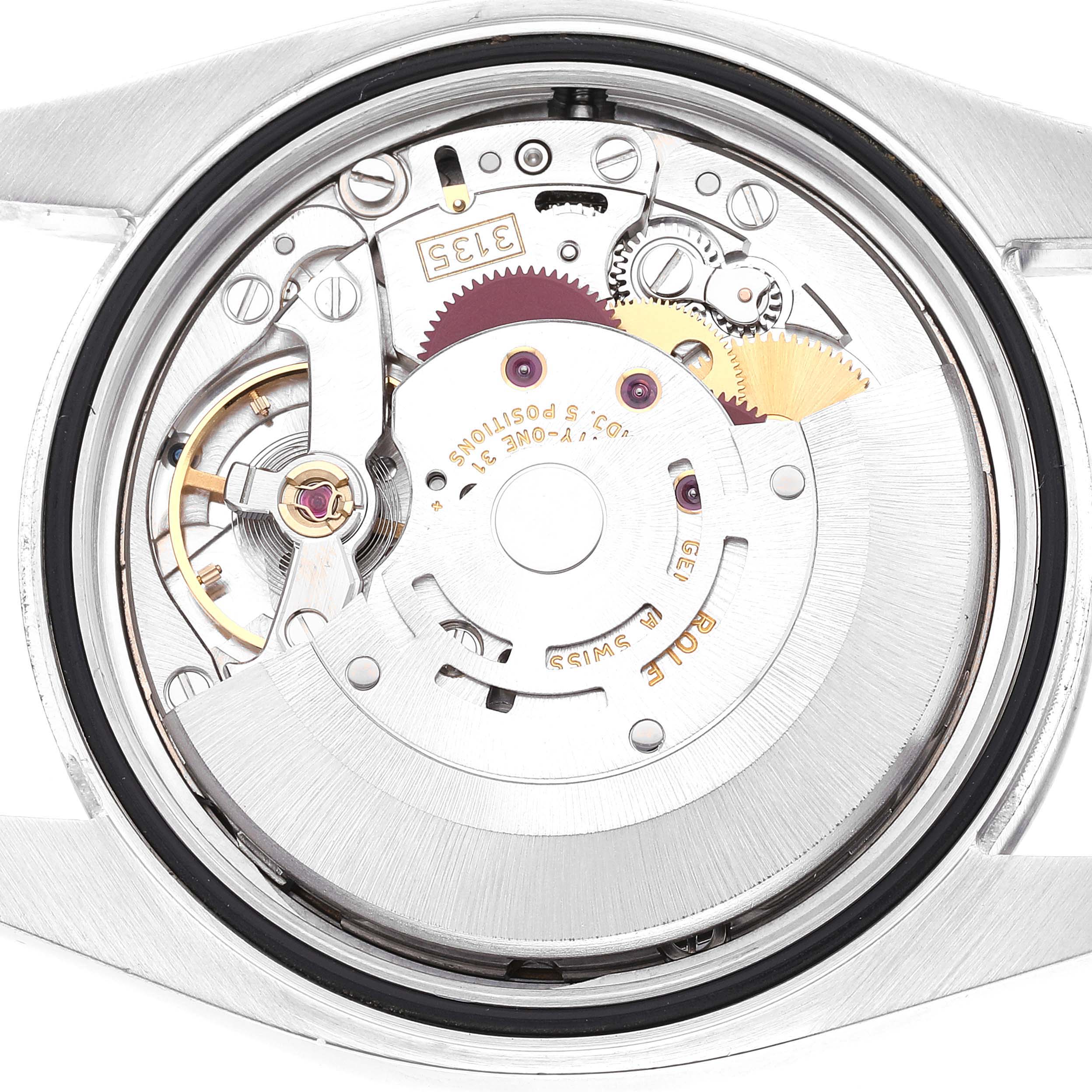 The image shows a close-up of the movement mechanism of a Rolex Datejust 116200 Men's Stainless Steel Blue Dial 116200 Men's Stainless Steel Blue Dial watch from the back.