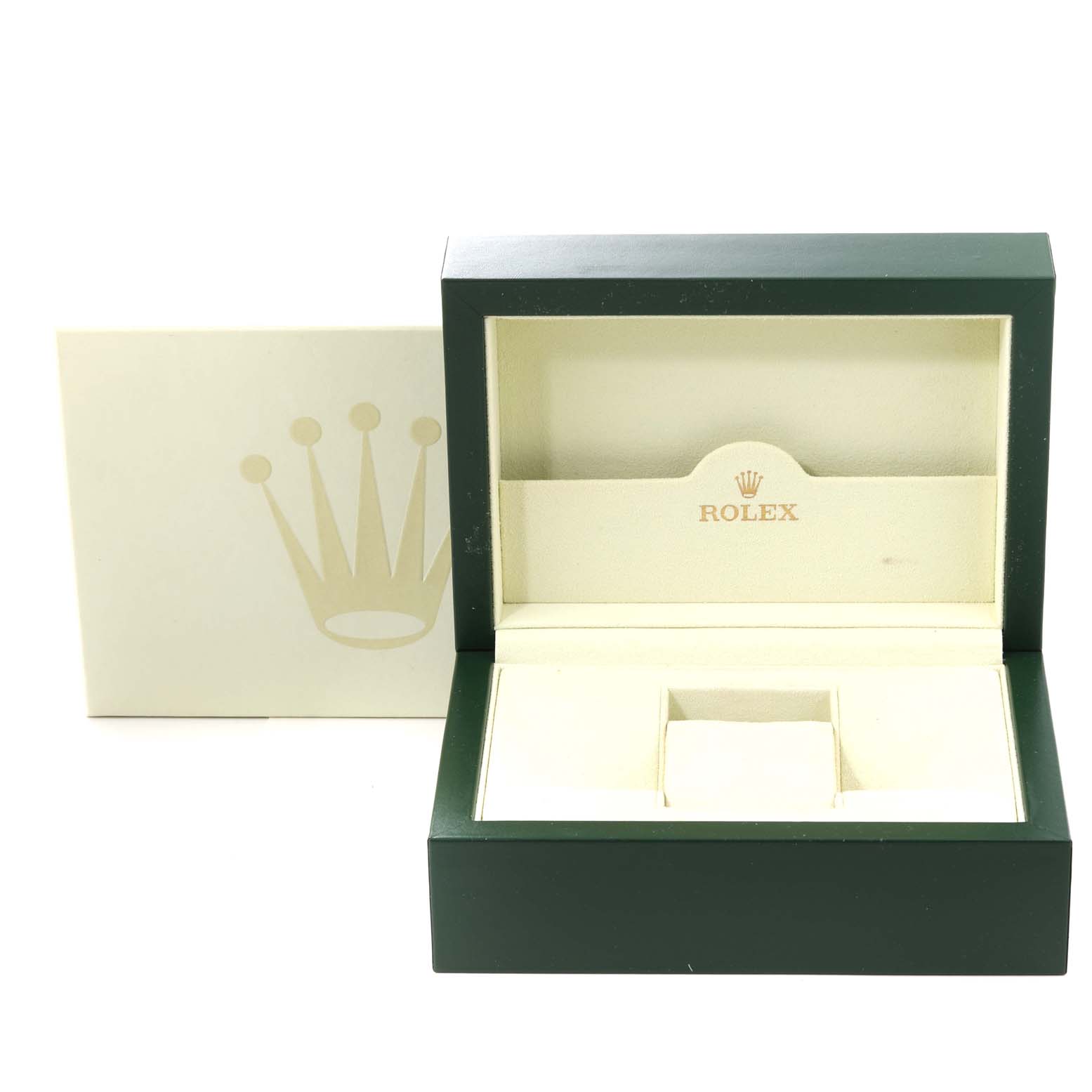 The image shows an open green and cream Rolex box for the Datejust model, viewed from the front.