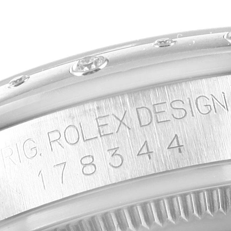 The image shows a close-up of the engraved bezel and case of a Rolex Datejust 178344 Women's Stainless Steel Mother of Pearl Dial 178344 Women's Stainless Steel Mother of Pearl Dial watch model.