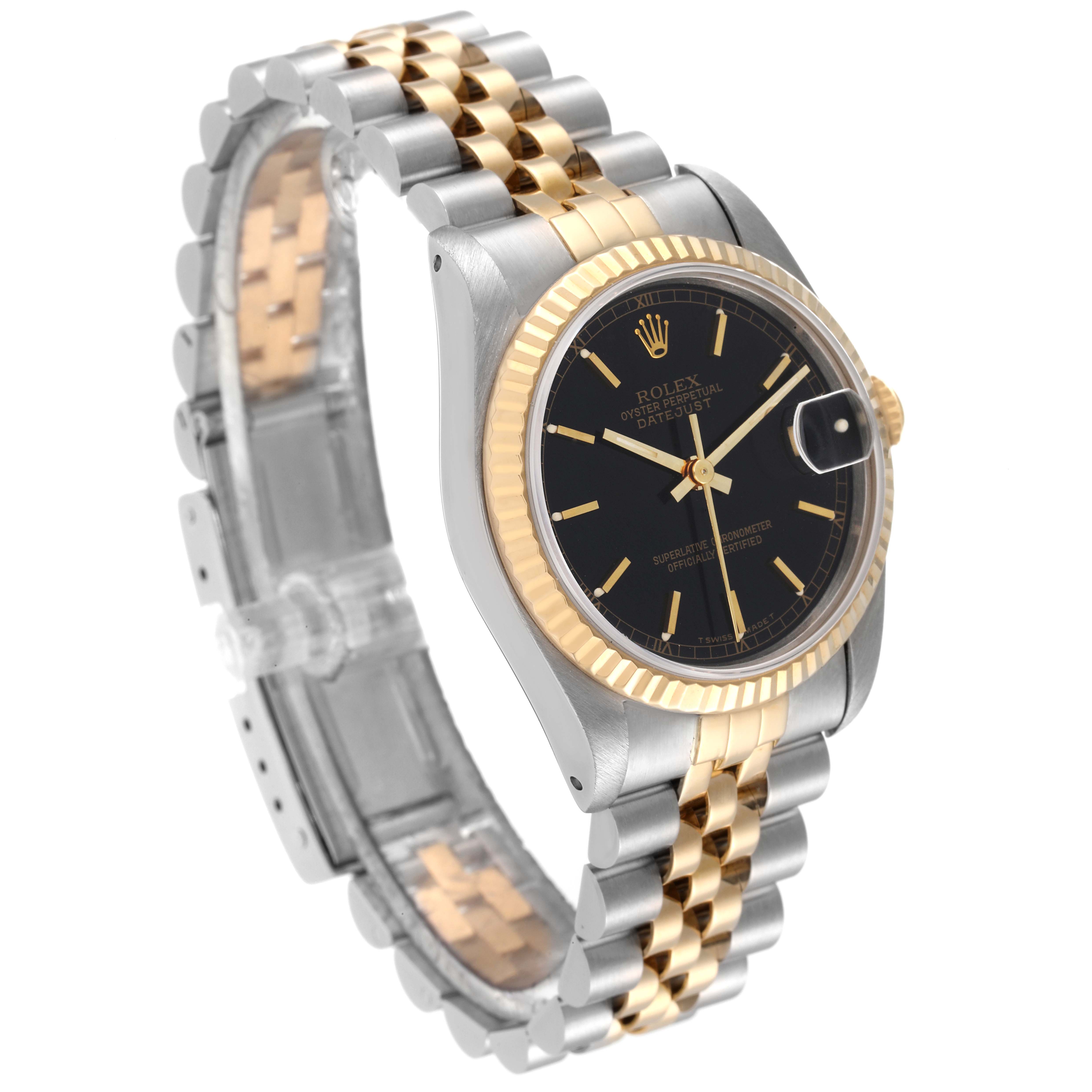 The Rolex Mid-Size 68273 Women
s Steel and Gold (two tone) Black Dial 68273 Women
s Steel and Gold (two tone) Black Dial model watch is shown at a three-quarter angle, highlighting its black dial, gold bezel, and two-tone bracelet.