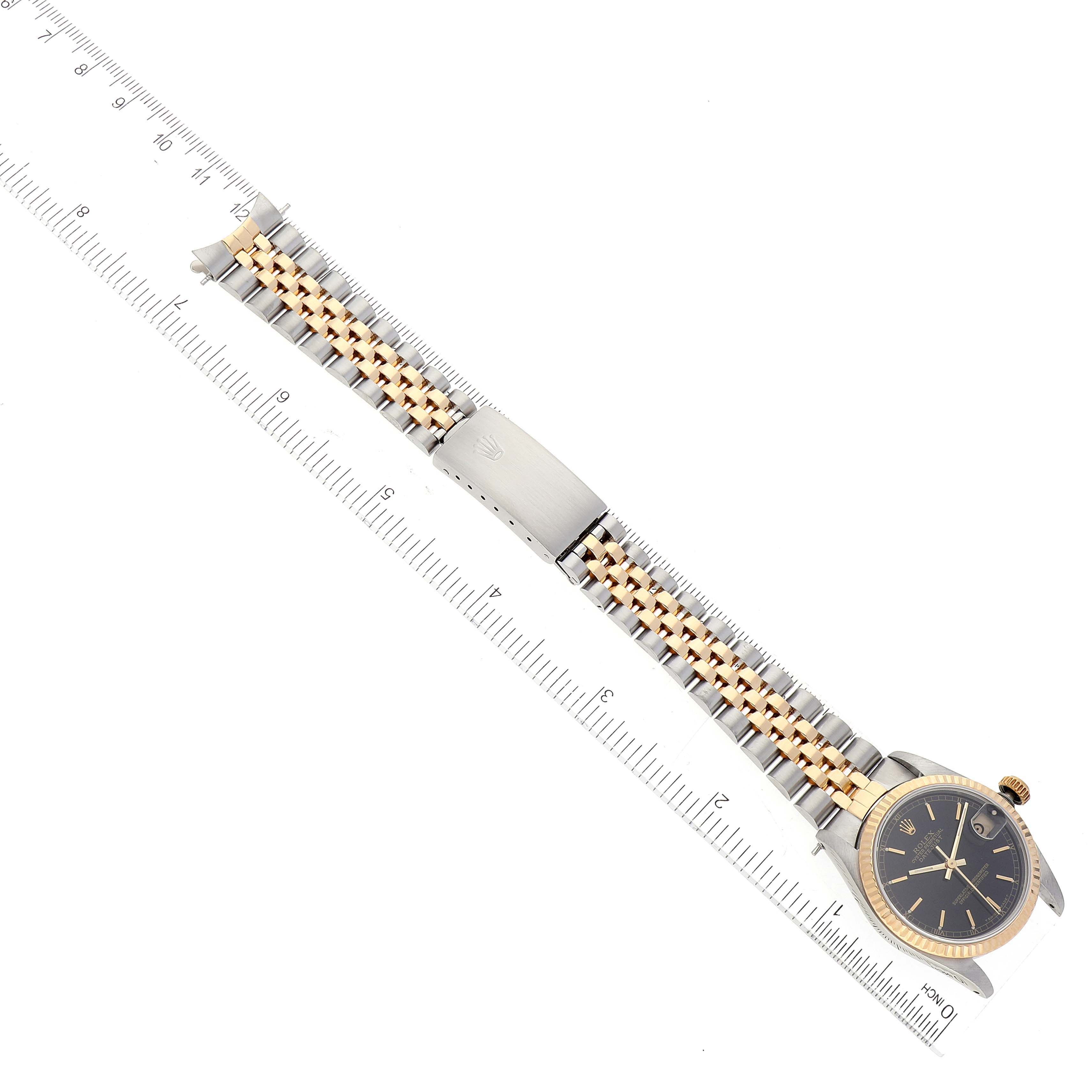 The image shows a mid-size Rolex watch from a top view, highlighting the face, bezel, crown, and two-tone bracelet.