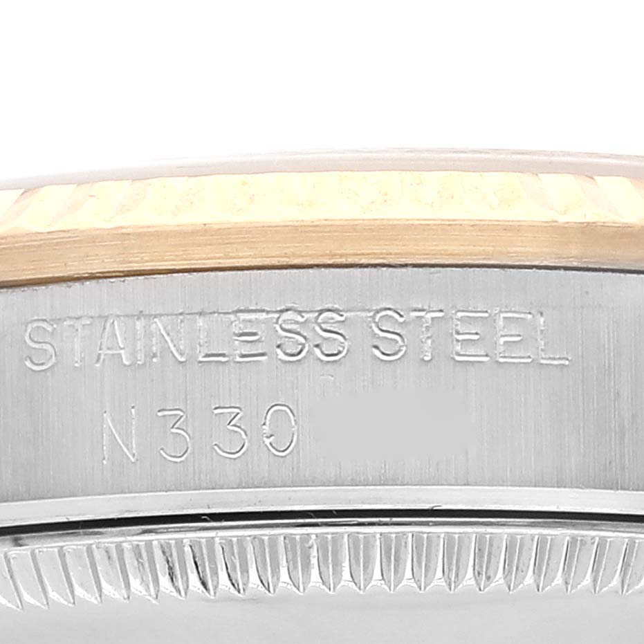 This is a close-up of the side engraving on a Mid-Size Rolex watch
s stainless steel case.