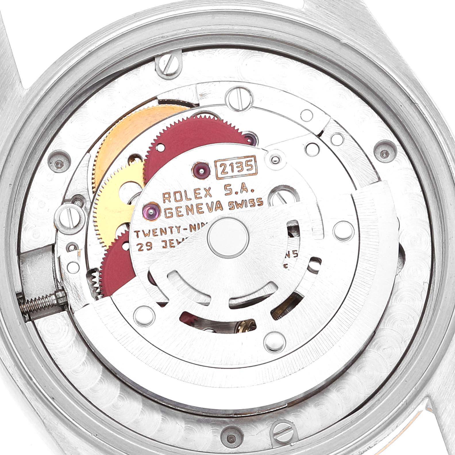 The image shows the internal mechanism and movement of a Mid-Size Rolex watch from the back.