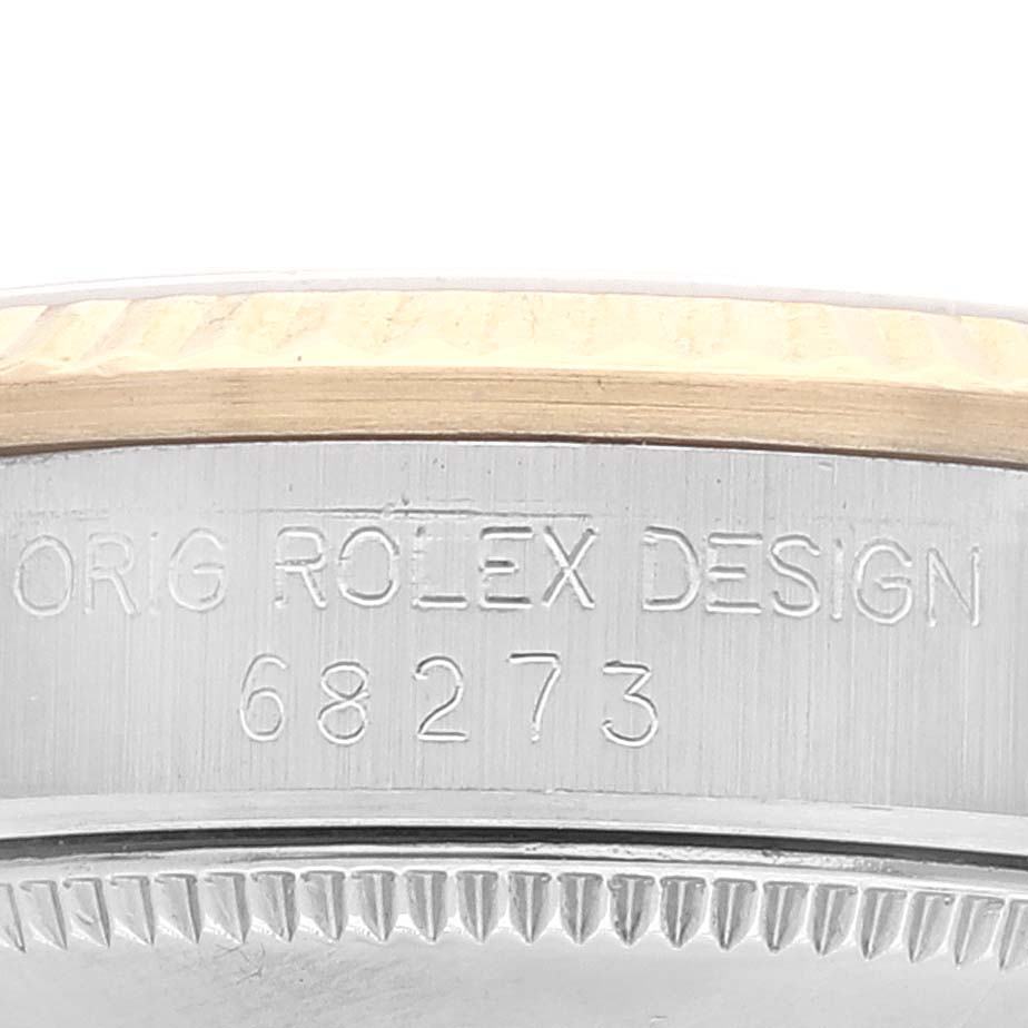 This close-up image shows the engraved model number and bezel detail of a Rolex Mid-Size 68273 Women
s Steel and Gold (two tone) Champagne Dial 68273 Women
s Steel and Gold (two tone) Champagne Dial watch.