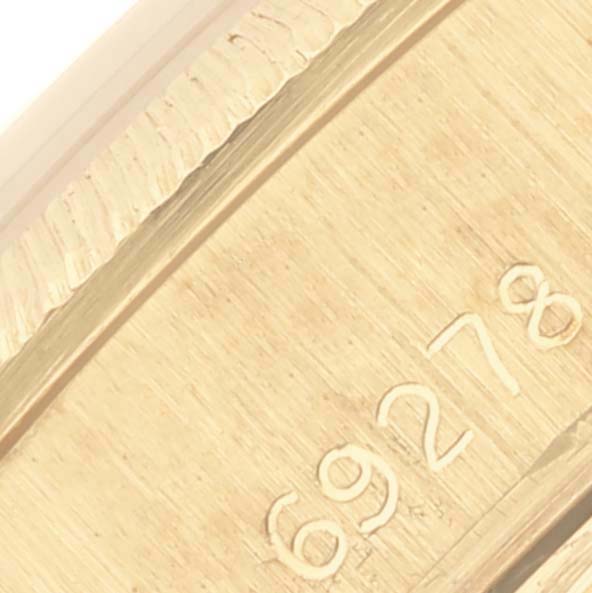 The image shows a close-up of the clasp with engravings on the Rolex President 69278 Women's Yellow Gold Champagne Dial 69278 Women's Yellow Gold Champagne Dial watch.