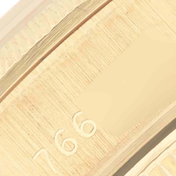 The image shows an angled close-up of the gold case rim for the Rolex President 69278 Women's Yellow Gold Champagne Dial 69278 Women's Yellow Gold Champagne Dial model, highlighting engraved markings.