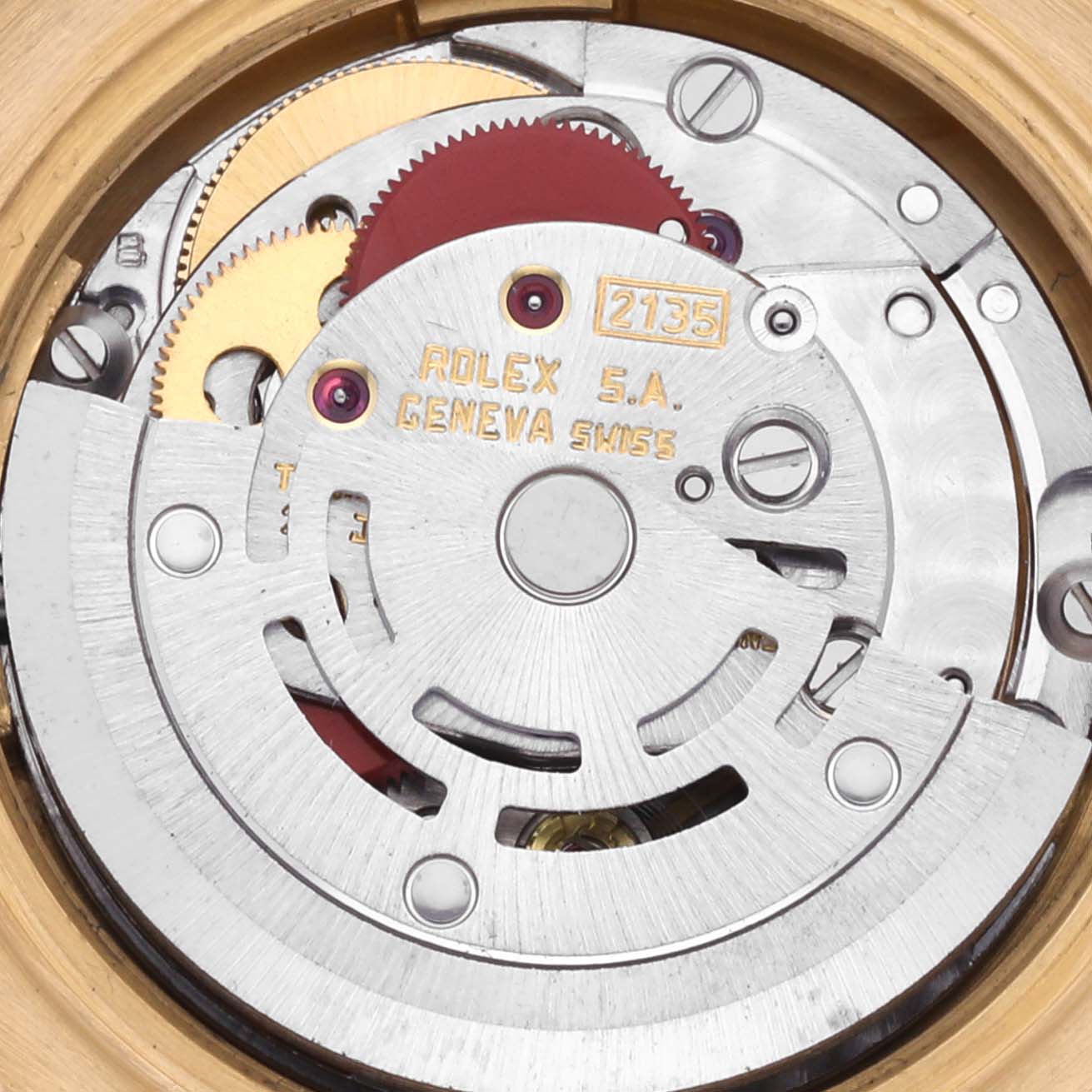 The image shows the inner mechanism of a Rolex President 69278 Women's Yellow Gold Champagne Dial 69278 Women's Yellow Gold Champagne Dial watch, highlighting gears and inscriptions.