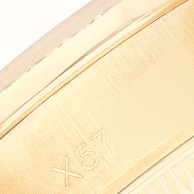 This image shows a close-up of the engraved inner caseback of a Rolex President 69158 Women
s Yellow Gold Champagne Dial 69158 Women
s Yellow Gold Champagne Dial model watch.