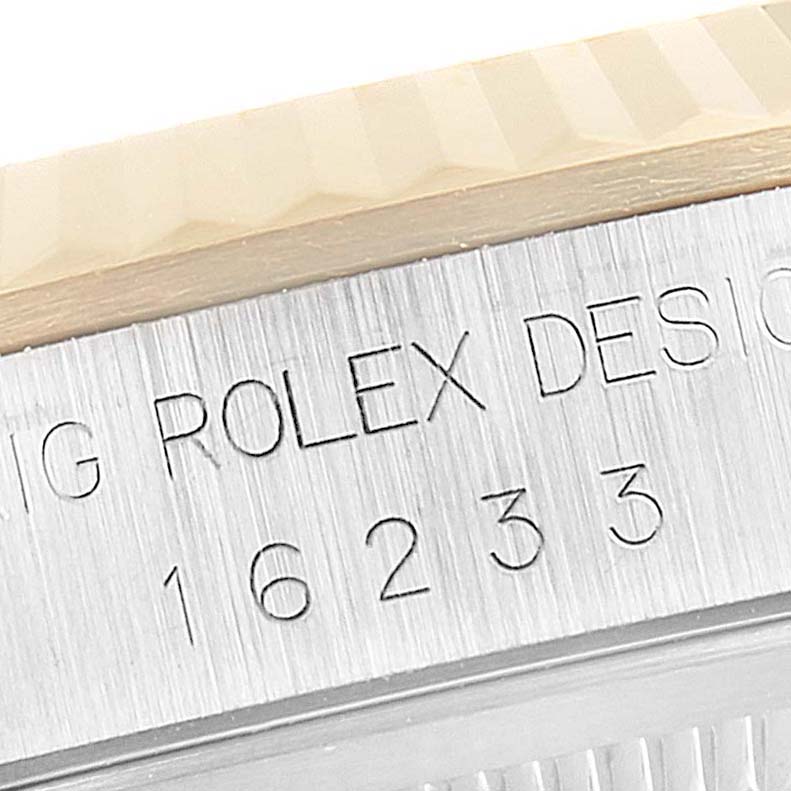 The image shows a close-up of the side of a Rolex Datejust 16233 Men's Steel and Gold (two tone) Champagne Dial 16233 Men's Steel and Gold (two tone) Champagne Dial watch, highlighting the model number 16233 and part of the bezel.