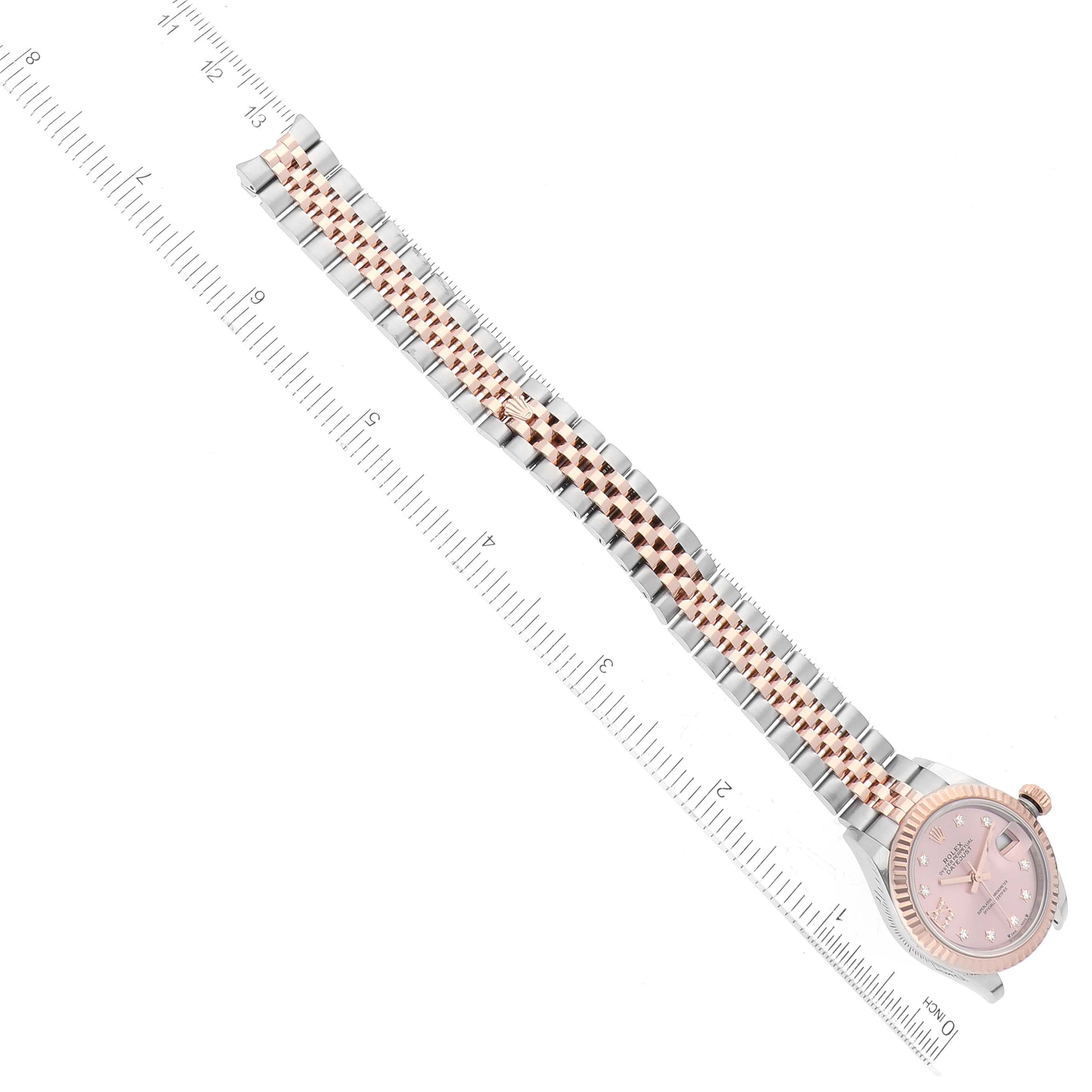 The image shows a Rolex Datejust 279171 Women's Stainless Steel Pink Dial 279171 Women's Stainless Steel Pink Dial watch laid horizontally, displaying its face and the full length of its bracelet next to a ruler.