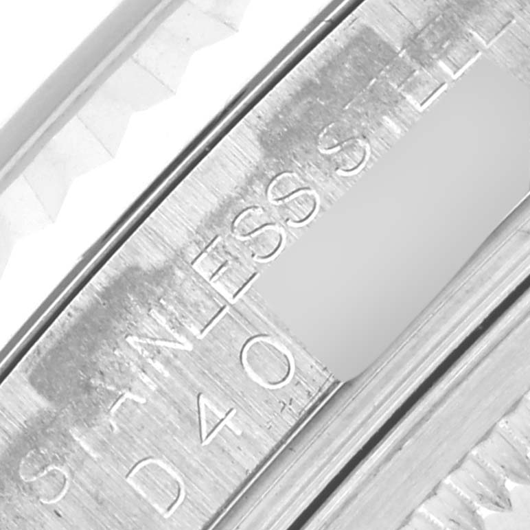 The image shows a close-up of the stainless steel bezel and engraving of a Rolex Datejust 116234 Men
s Stainless Steel Black Dial 116234 Men
s Stainless Steel Black Dial watch.