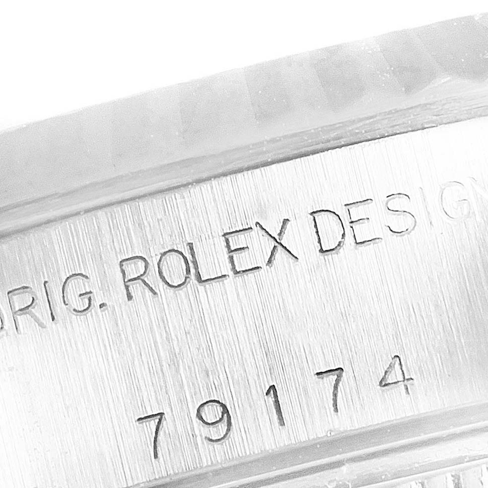 This image shows the side engraving on a Rolex Datejust 79174 Women
s Stainless Steel Blue Dial 79174 Women
s Stainless Steel Blue Dial watch casing, highlighting the model number 79174.