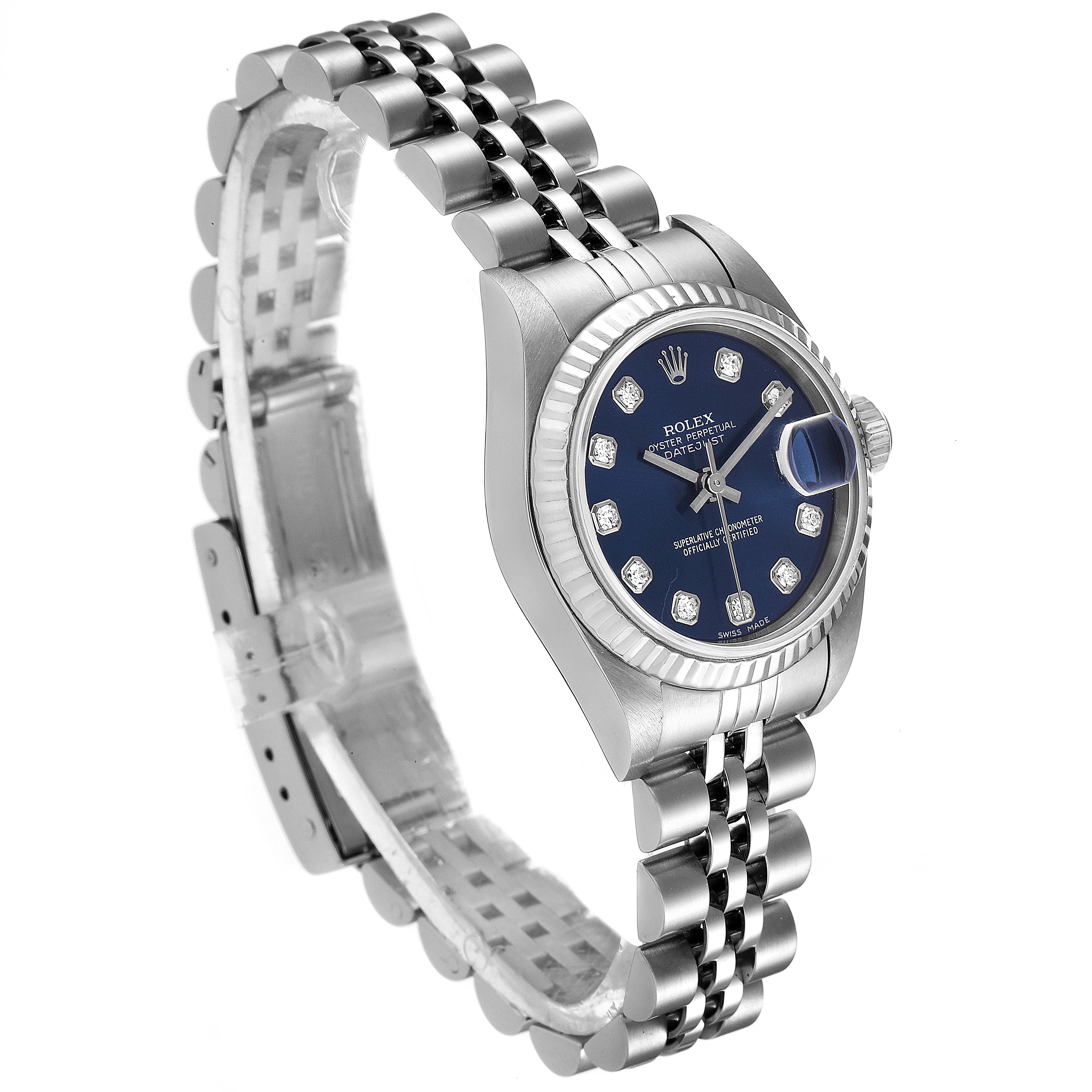 The Rolex Datejust 79174 Women
s Stainless Steel Blue Dial 79174 Women
s Stainless Steel Blue Dial watch is shown at a three-quarter angle, highlighting its face, bezel, crown, and bracelet.