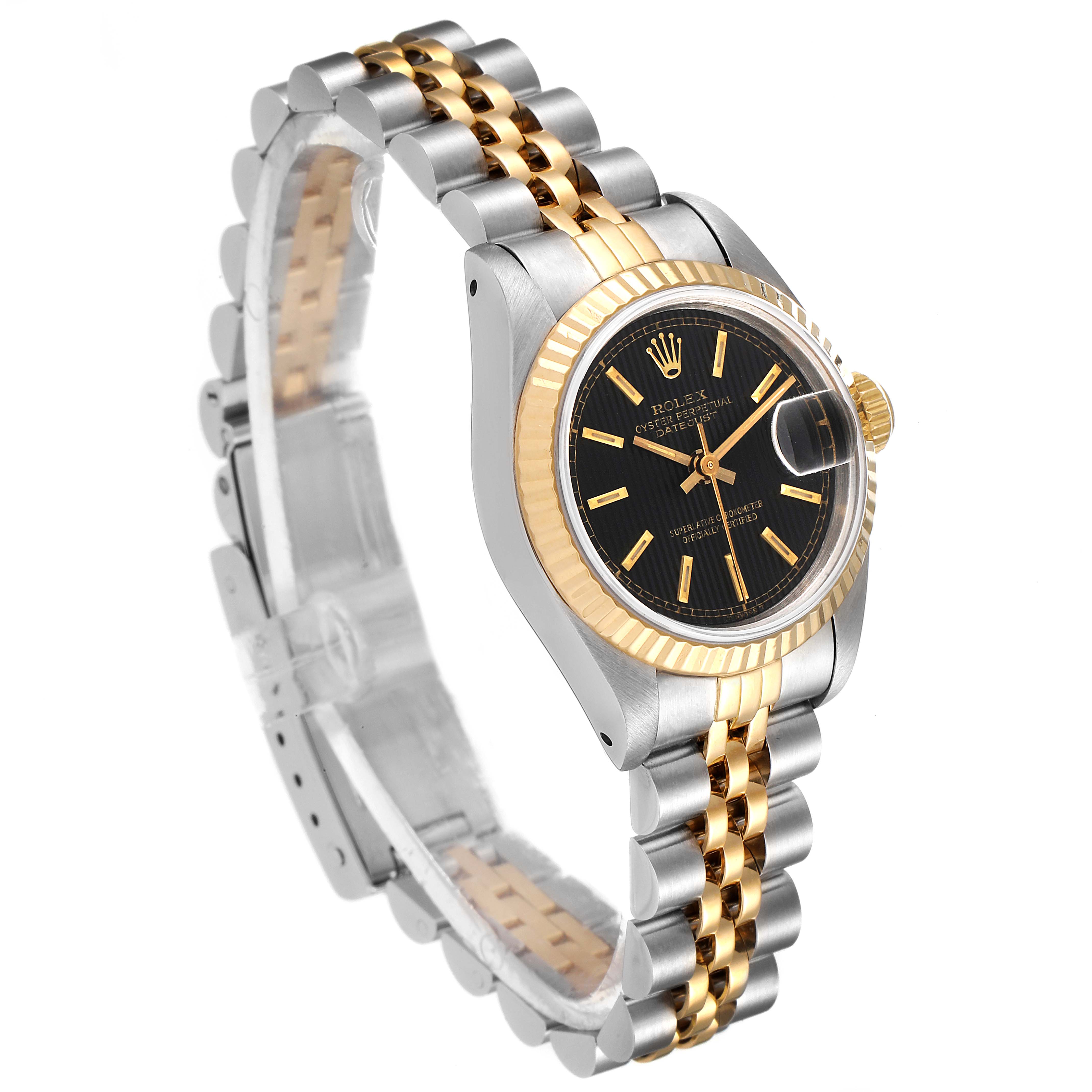 The image shows a Rolex Datejust 69173 Women's Steel and Gold (two tone) Black Dial 69173 Women's Steel and Gold (two tone) Black Dial watch at an angle, highlighting its gold and silver Jubilee bracelet, black dial, and fluted bezel.