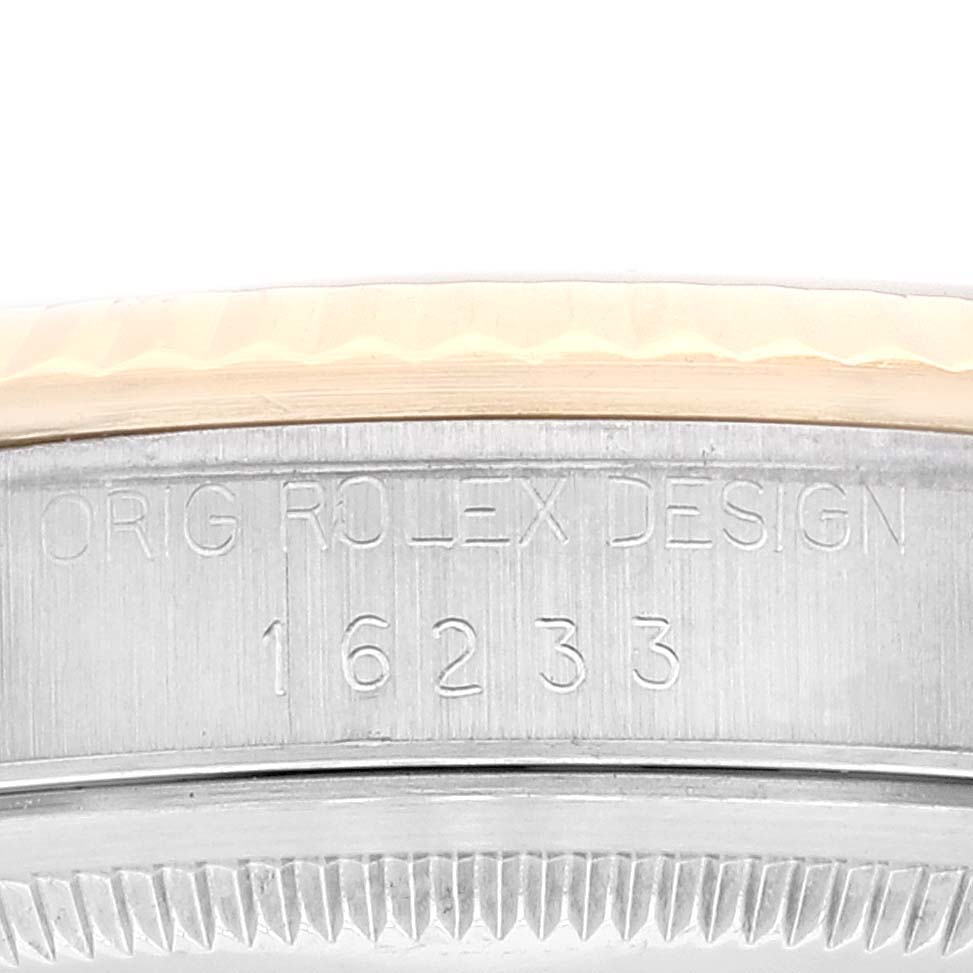 The image shows the side of the Rolex Datejust 16233 Men's Steel and Gold (two tone) Champagne Dial 16233 Men's Steel and Gold (two tone) Champagne Dial model with the "Orig Rolex Design" engraving and model number 16233.