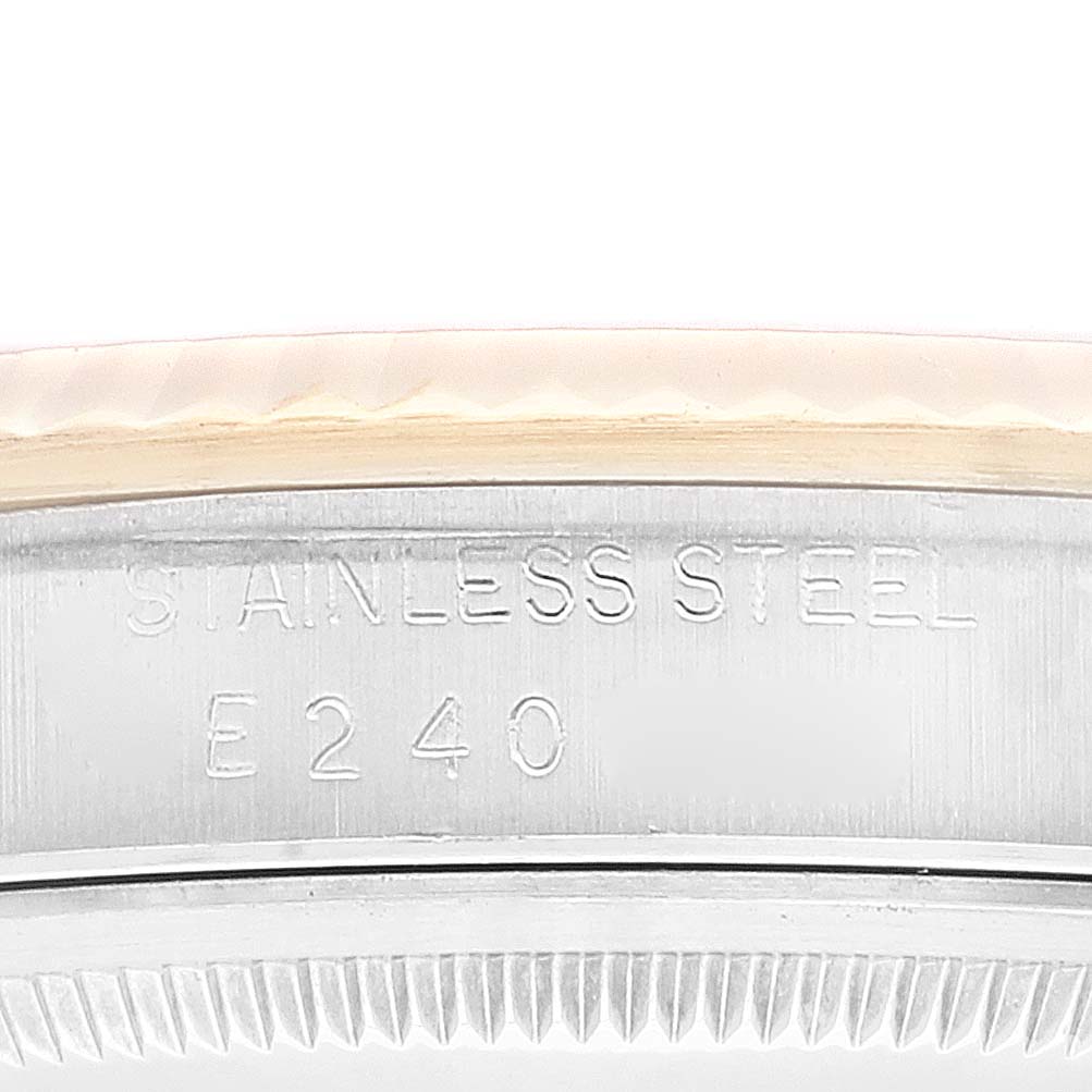 This image shows a close-up of the stainless steel bezel with inscriptions of a Rolex Datejust 16233 Men's Steel and Gold (two tone) Champagne Dial 16233 Men's Steel and Gold (two tone) Champagne Dial watch.