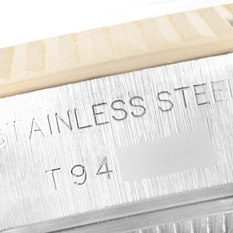 The image shows a close-up of the stainless steel part of a Rolex Datejust 69173 Women's Steel and Gold (two tone) Blue Dial 69173 Women's Steel and Gold (two tone) Blue Dial watch with part of the bezel visible.