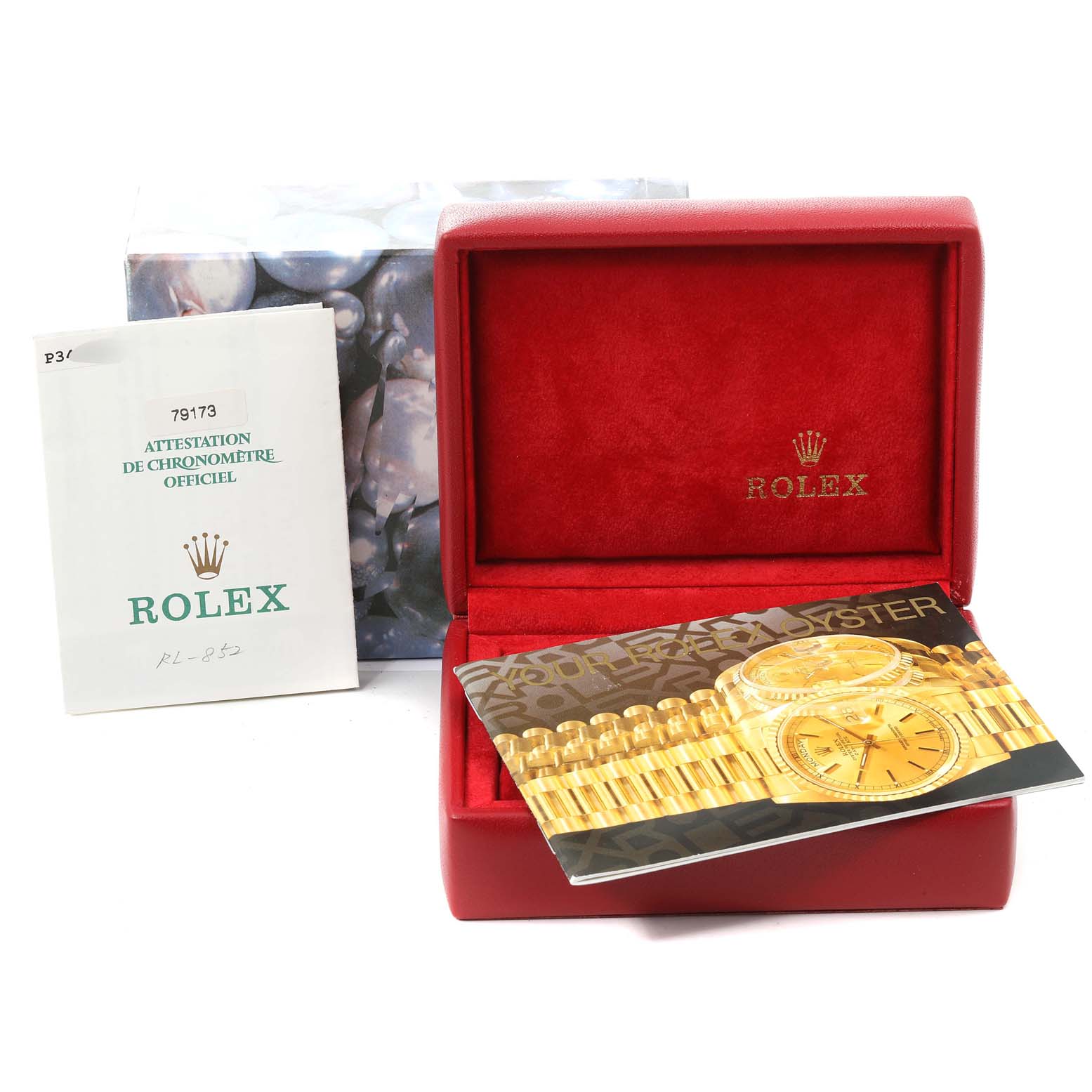 This image shows a Rolex Datejust 79173 Women's Steel and Gold (two tone) Mother of Pearl Dial 79173 Women's Steel and Gold (two tone) Mother of Pearl Dial model watch box, documentation, and a pamphlet, photographed from the front.