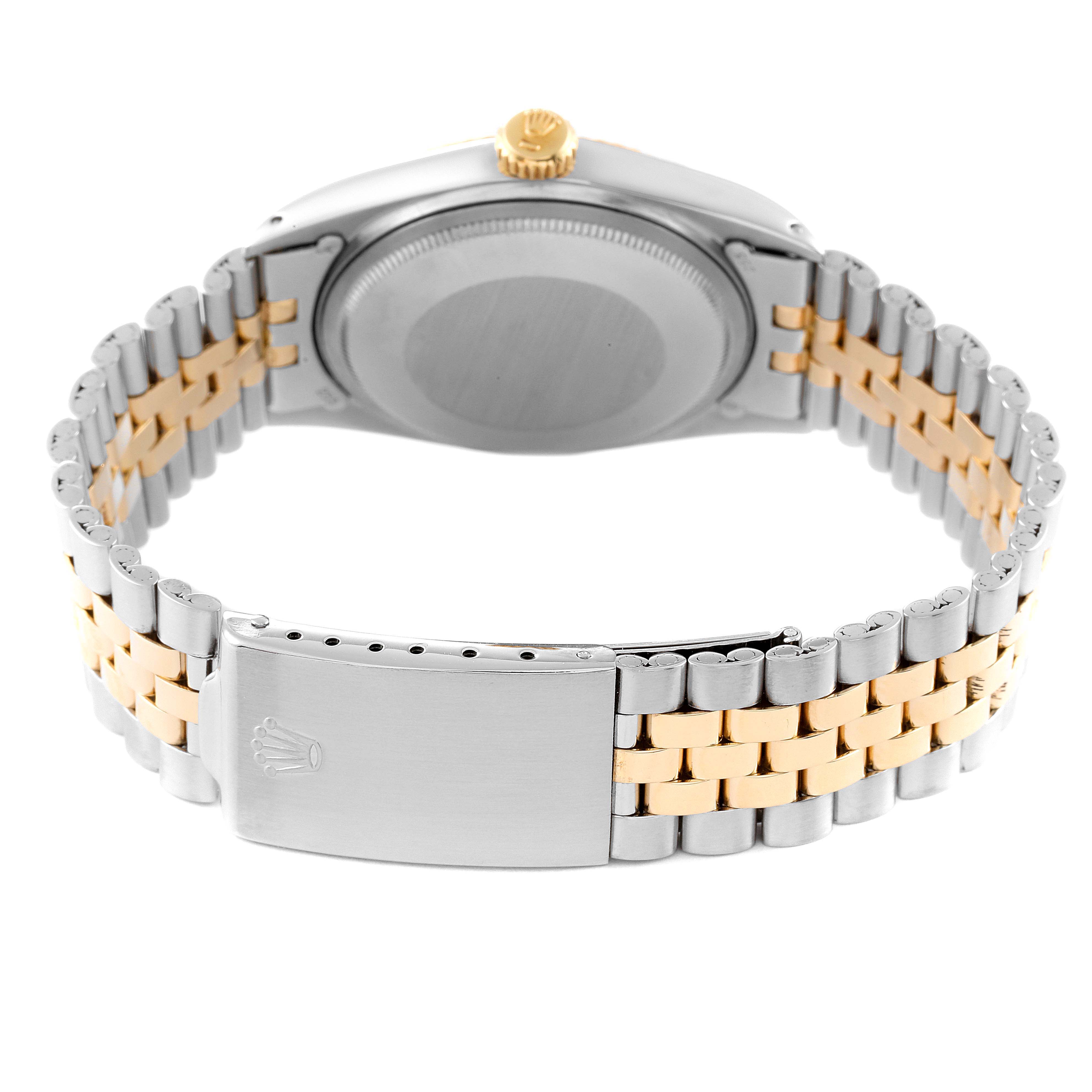 The image shows the back view of a Rolex Vintage Collection 1601 Men
s Steel and Gold (two tone) Silver Dial 1601 Men
s Steel and Gold (two tone) Silver Dial watch, highlighting the two-tone bracelet and the clasp.