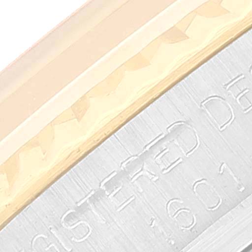 The image shows a close-up of the edge and part of the case back with engravings of a Vintage Collection model by Rolex.