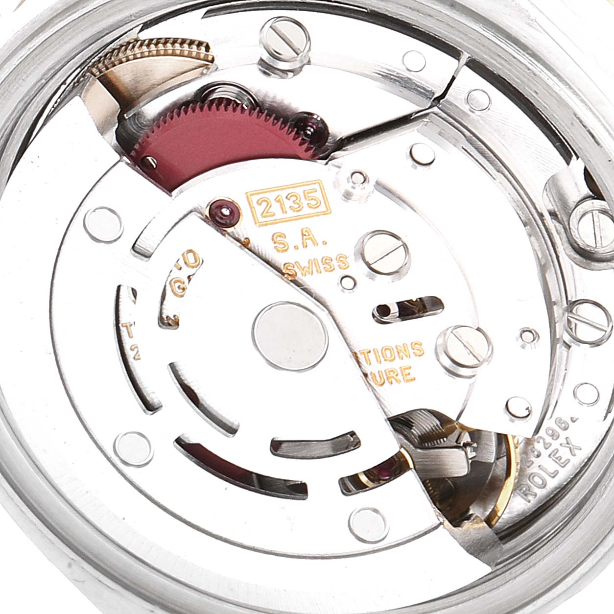 The image shows the internal movement mechanism of a Rolex Datejust 69173 Women's Steel and Gold (two tone) White Dial 69173 Women's Steel and Gold (two tone) White Dial watch, showcasing gears and components.