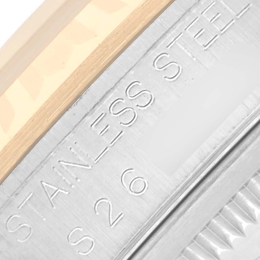 The image shows an angled close-up of the Rolex Datejust 16233 Men's Steel and Gold (two tone) White Dial 16233 Men's Steel and Gold (two tone) White Dial's stainless steel and gold fluted bezel.