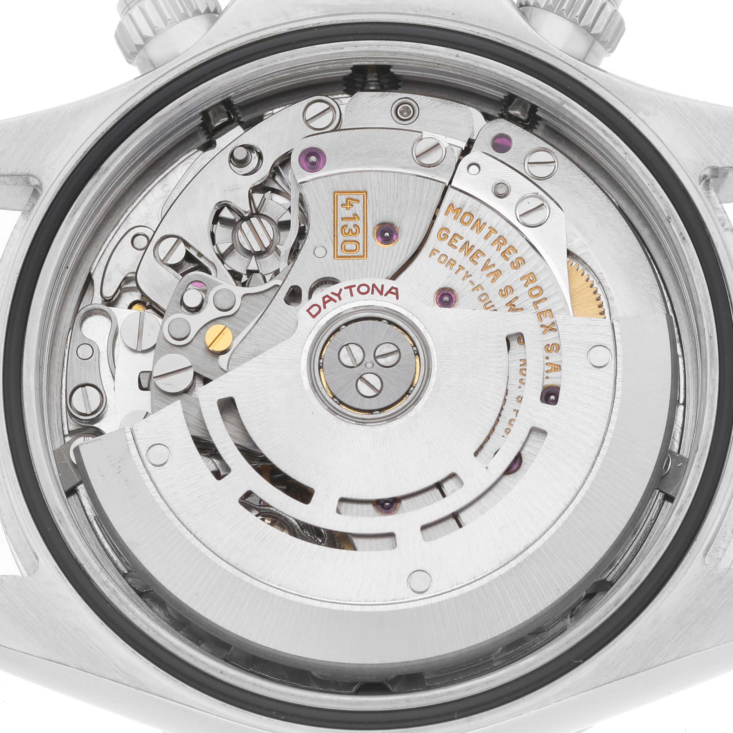 The image shows a close-up of the movement in the Rolex Daytona 116520 Men's Stainless Steel Black Dial watch, highlighting the gears and rotor from the back.