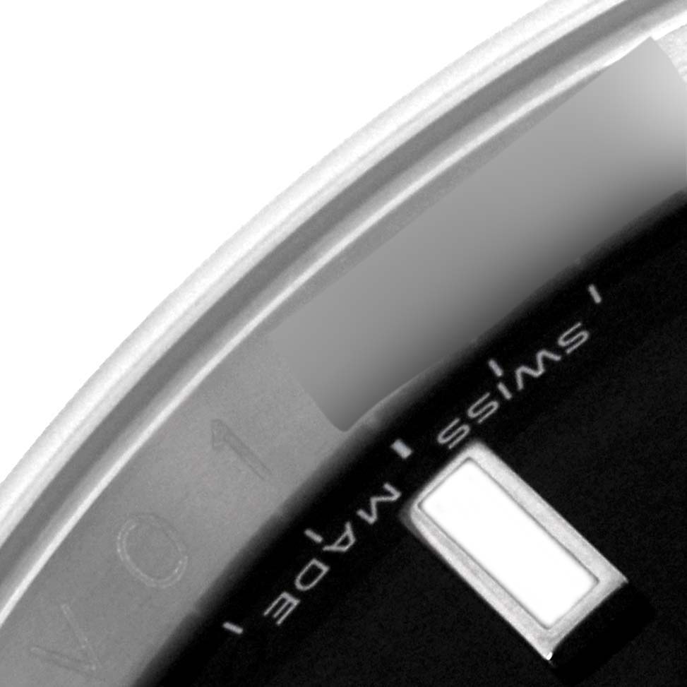 The image shows a close-up of the bottom rim and part of the dial of a Rolex Explorer 16570T Men
s Stainless Steel Black Dial 16570T Men
s Stainless Steel Black Dial watch.
