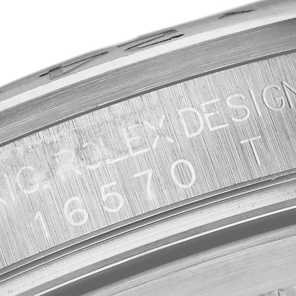 The image shows a close-up of the Rolex Explorer 16570 Men's Stainless Steel White Dial 16570 Men's Stainless Steel White Dial's case, highlighting the engraved model number "16570."