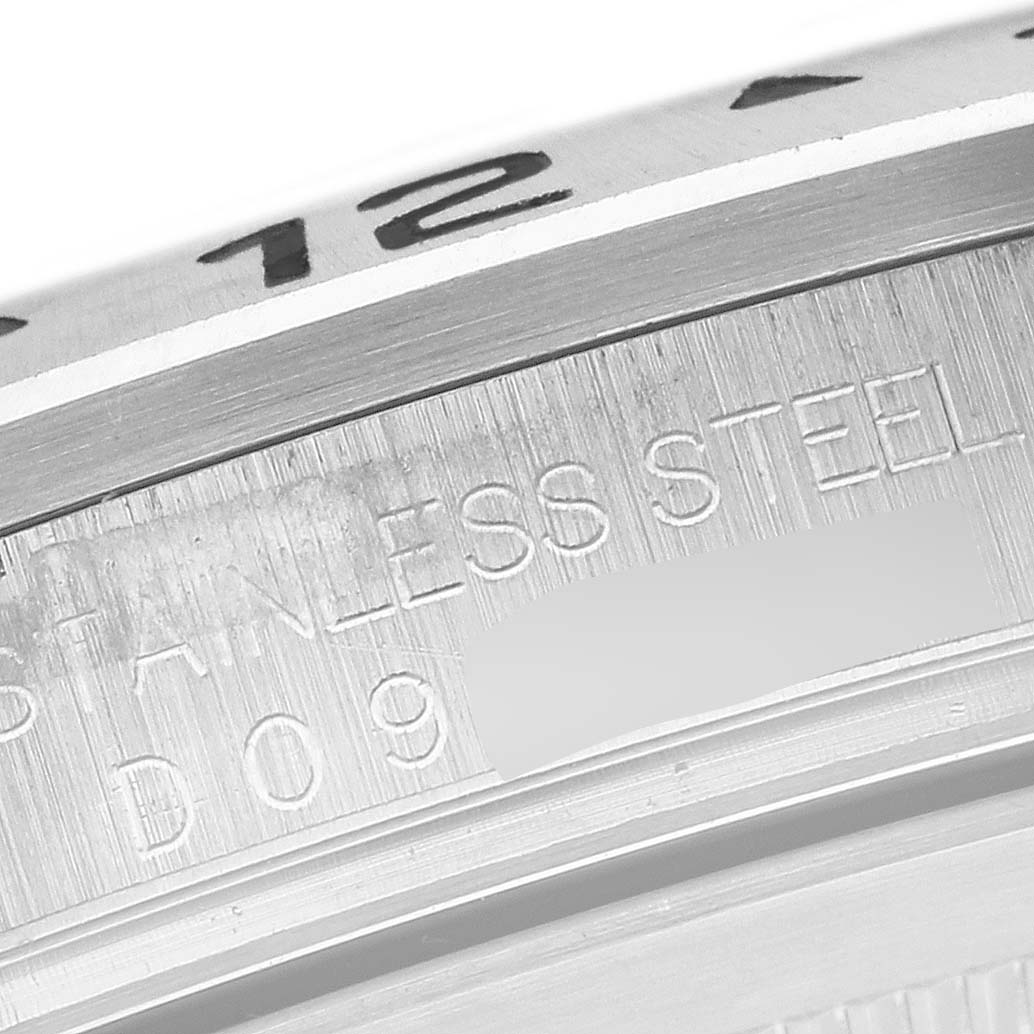 The image shows a close-up angle of the Rolex Explorer 16570 Men's Stainless Steel White Dial 16570 Men's Stainless Steel White Dial's stainless steel part with engraved text.