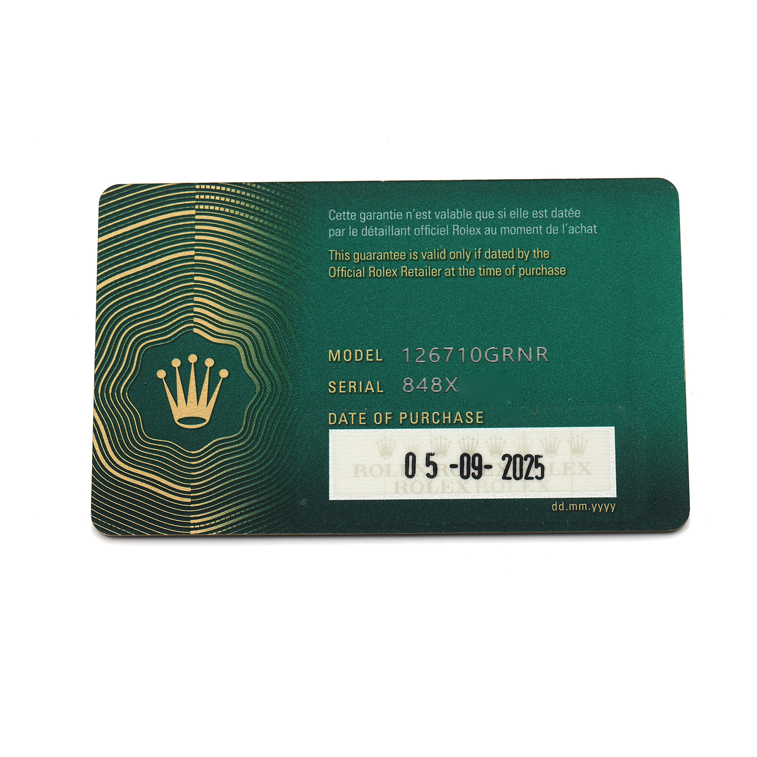 The image shows a green Rolex warranty card for the GMT-Master model, featuring model and serial numbers, and date of purchase.