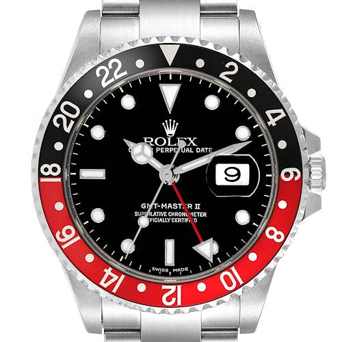 The Rolex GMT-Master watch is shown from a top-down angle, displaying the bezel, dial, and partial bracelet.