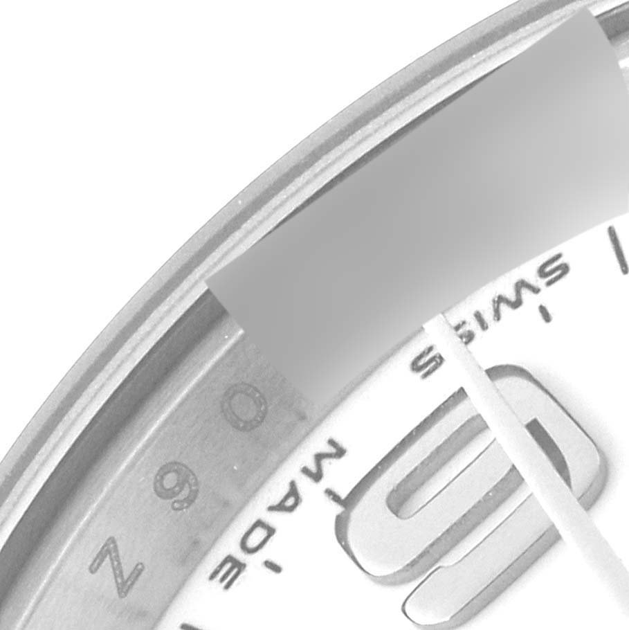 This close-up image shows a partial view of the dial and bezel of a Rolex Oyster Perpetual 176210 Women's Stainless Steel White Dial 176210 Women's Stainless Steel White Dial watch.