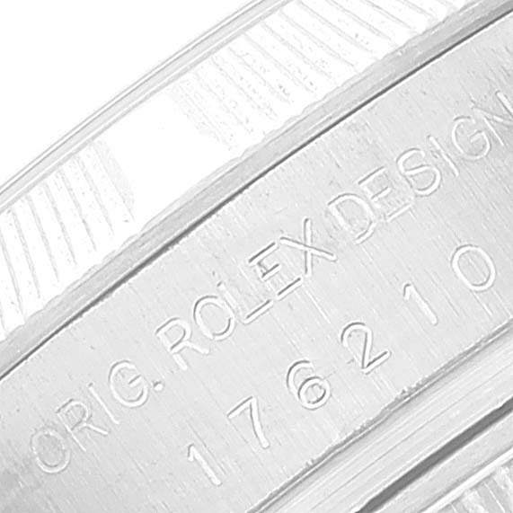 This image shows a close-up view of the serial number engraving on the case of a Rolex Oyster Perpetual 176210 Women's Stainless Steel White Dial 176210 Women's Stainless Steel White Dial watch.