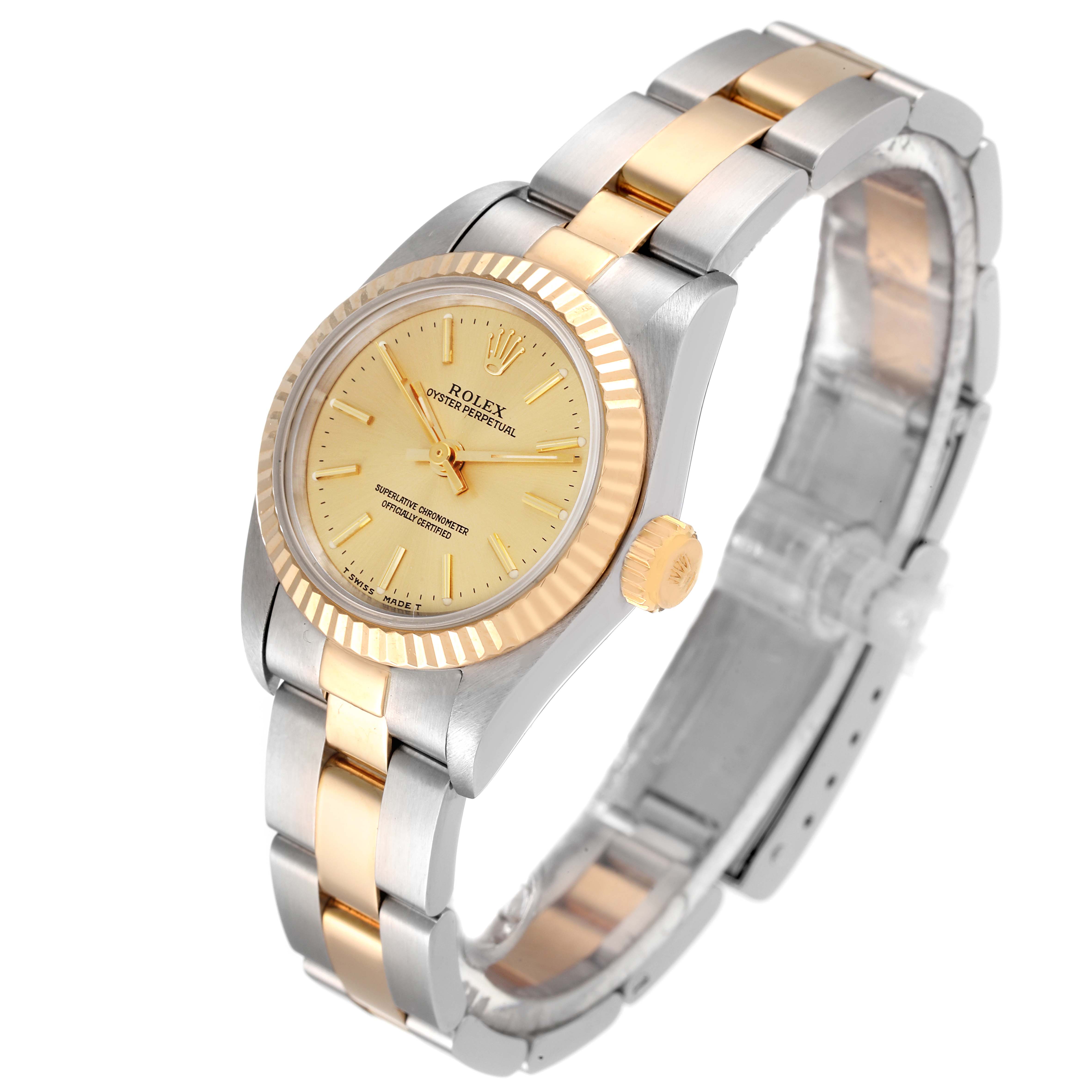 This image shows a side view of a Rolex Oyster Perpetual 67193 Women's Steel and Gold (two tone) Champagne Dial 67193 Women's Steel and Gold (two tone) Champagne Dial watch, highlighting its two-tone bracelet and fluted bezel.