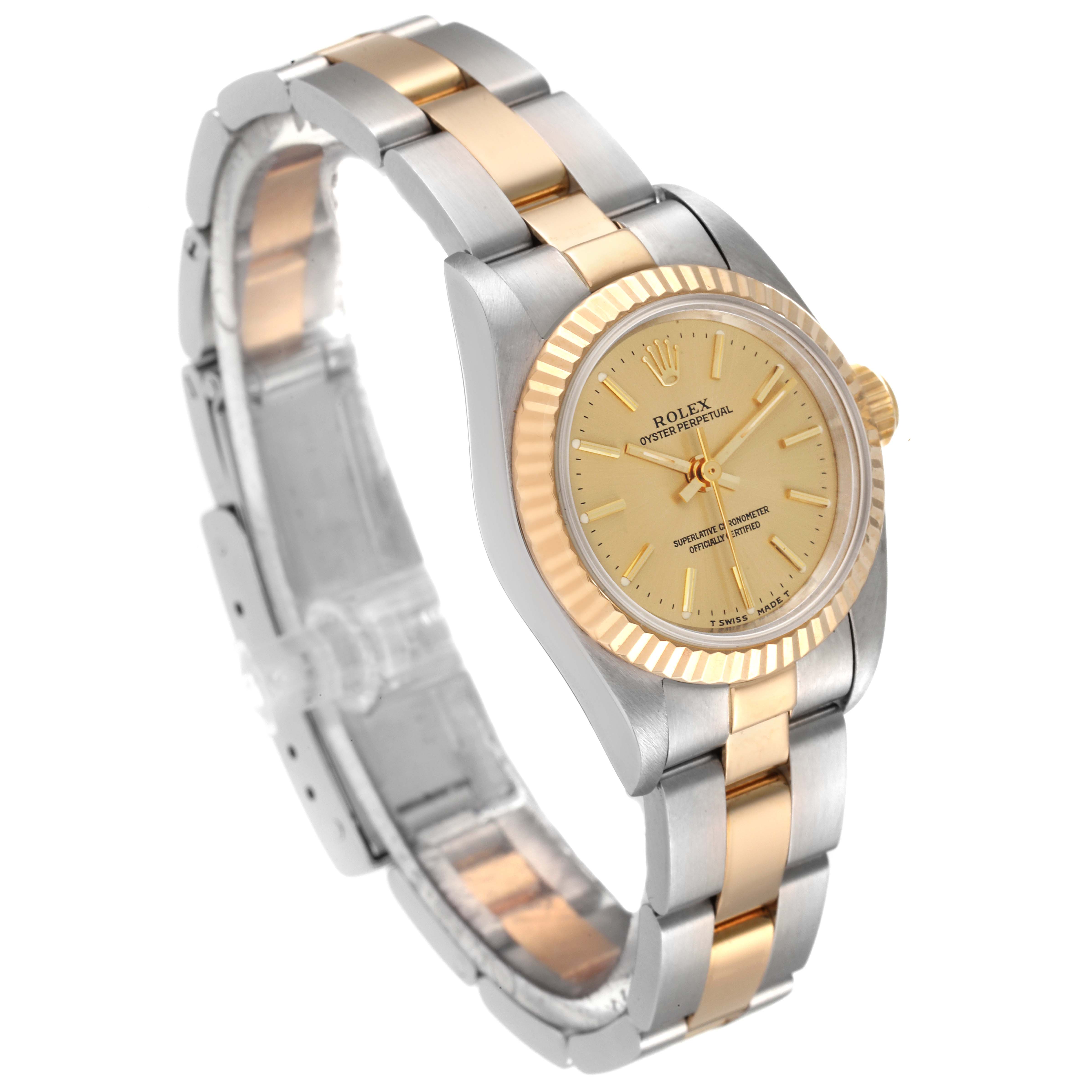 The Rolex Oyster Perpetual 67193 Women's Steel and Gold (two tone) Champagne Dial 67193 Women's Steel and Gold (two tone) Champagne Dial watch is shown at an angle displaying the dial, bezel, case, and part of the bracelet.