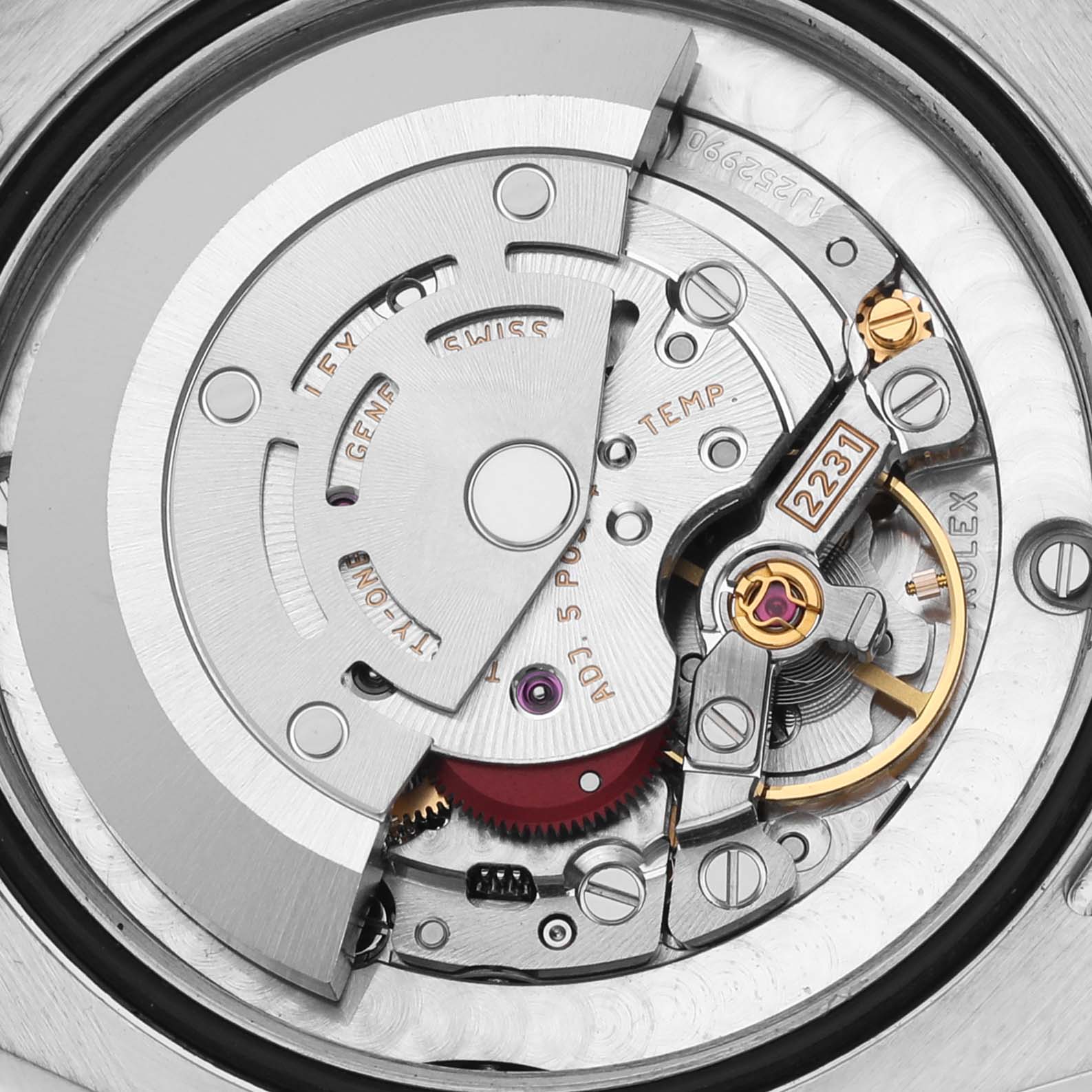 The image shows a close-up of the movement of a Rolex Mid-Size 177200 Women's Stainless Steel Blue Dial 177200 Women's Stainless Steel Blue Dial model, highlighting its intricate mechanical parts.