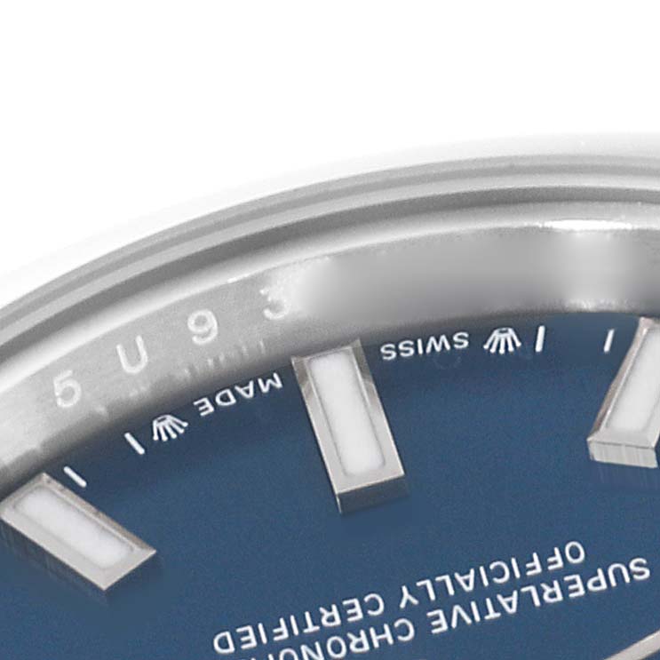 The image shows a close-up of the dial and part of the bezel of a Rolex Oyster Perpetual 276200 Women's Stainless Steel Blue Dial 276200 Women's Stainless Steel Blue Dial watch, focusing on the engraved "5 U 9 3" and text details.