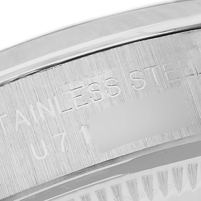 The image shows the engraved stainless steel case back of a Rolex Oyster Perpetual 67180 Women's Stainless Steel Pink Dial 67180 Women's Stainless Steel Pink Dial watch.